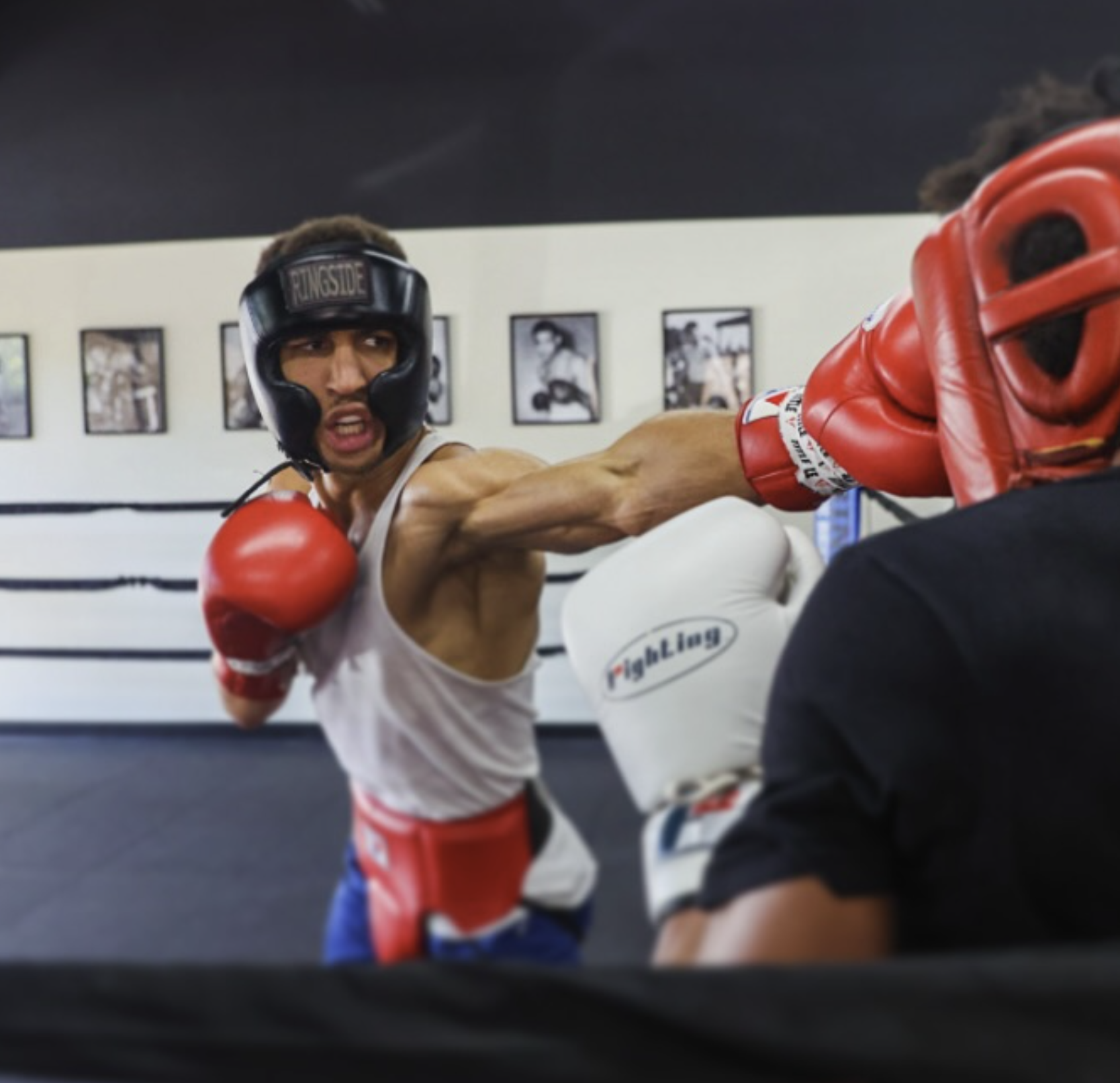 David Kasindi Kongo throwing a jab during sparring session with headgear and boxing gloves