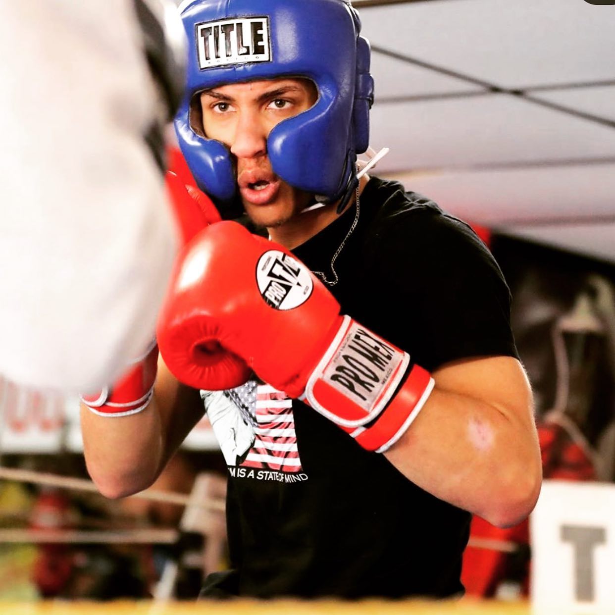 David Kasindi Kongo throwing punch during sparring at Lewisville Boxing Team with Coach Jamaal Lawson